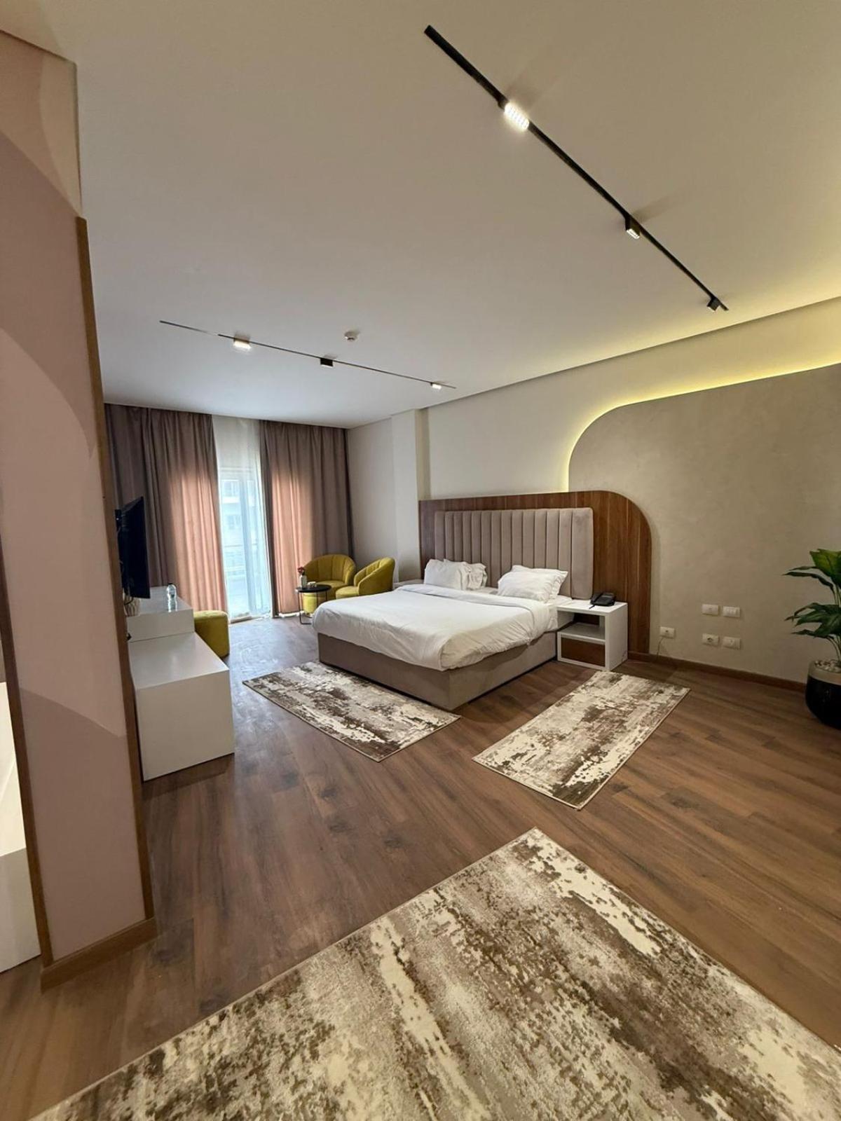 Tolip Family Park Hotel Káhira Exteriér fotografie A bedroom at the hotel